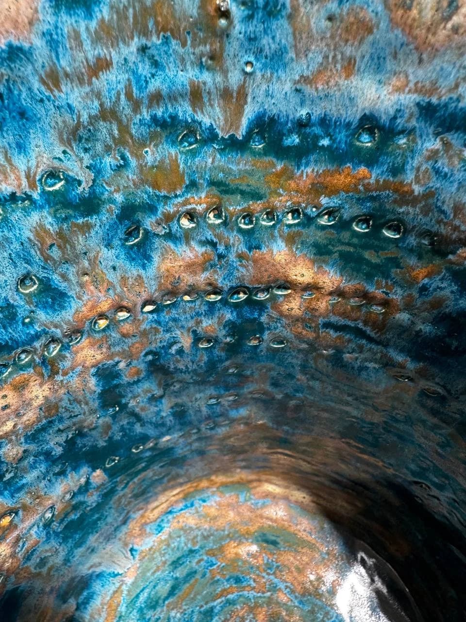 Close detail of glaze and repeated marks inside the kashk-sab vessel.