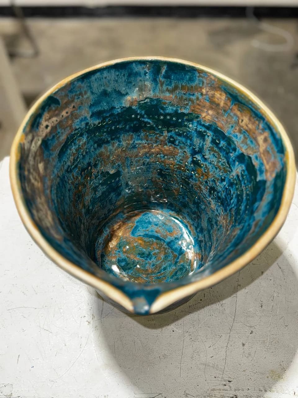 Glazed interior and pouring edge of the ceramic kashk-sab vessel.