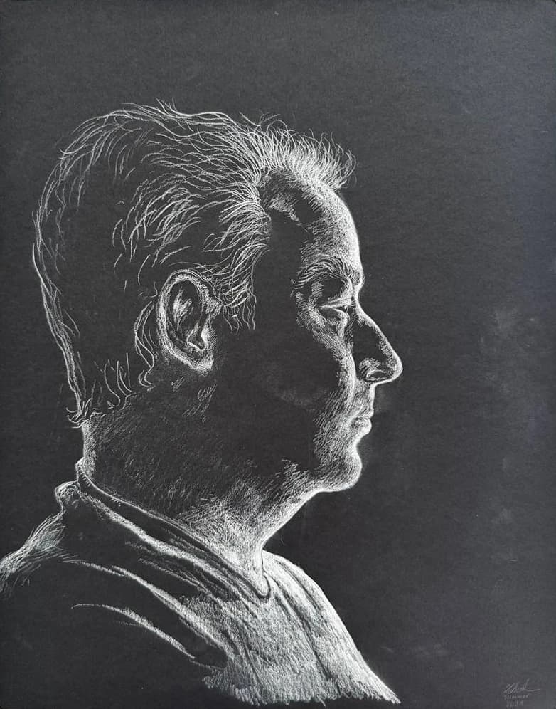 A right-facing profile portrait in white marks on black paper.
