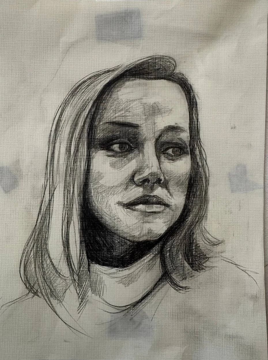 A shaded head-and-shoulders portrait on textured paper.